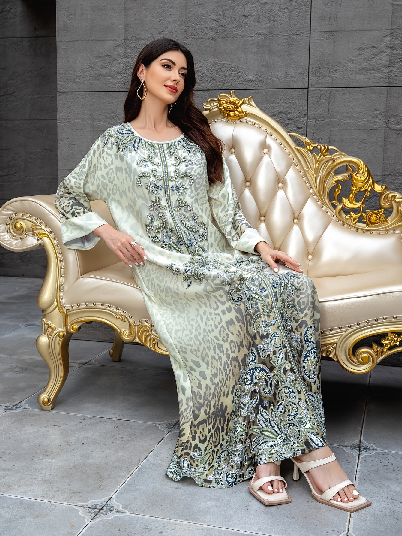 Orientated spot goods. It's a Muslim Women's long robe for the Middle East. It has prints for Ramadan, turned-up sleeves, and is embellished with hotfix rhinestones and beads. It's an elegant lady's Abaya, an Arabian dress ca